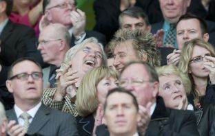 Billy Connolly and Rod Stewart share a joke back in 2010.