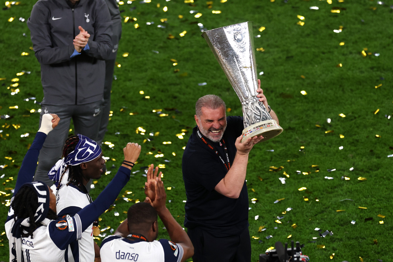 Ange Postecoglou lifts the Europa League Trophy