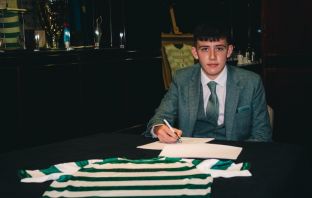 Liam Kennedy signs his first professional contract with Celtic.