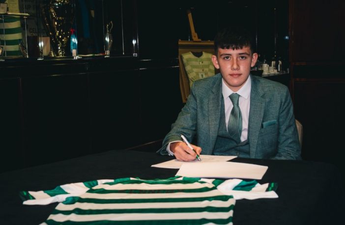 Liam Kennedy signs his first professional contract with Celtic.