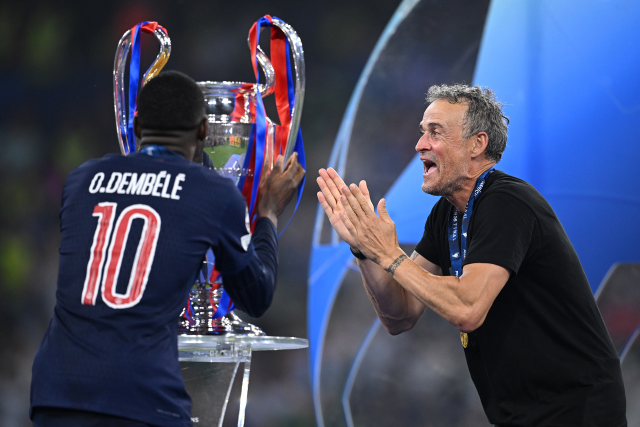 Luis Enrique, Head Coach of Paris Saint-Germain, reacts with Ousmane Dembele