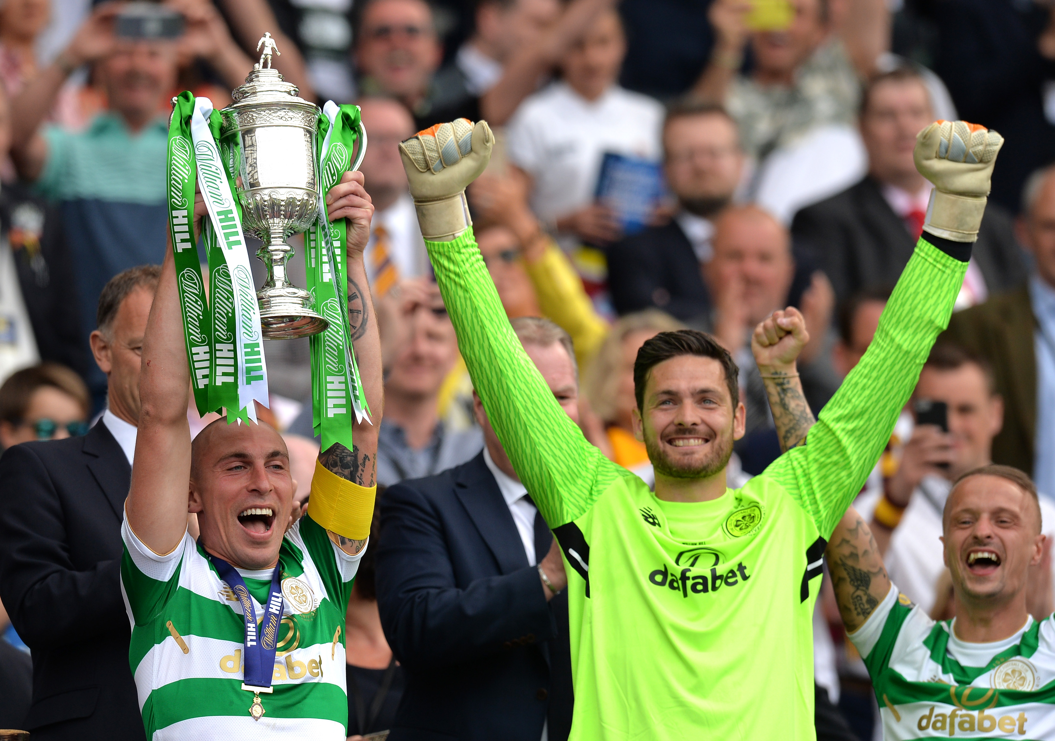 Scott Brown of Celtic holds the Scottish Cup 
