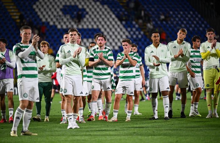 Celtic players applaud the Celtic support