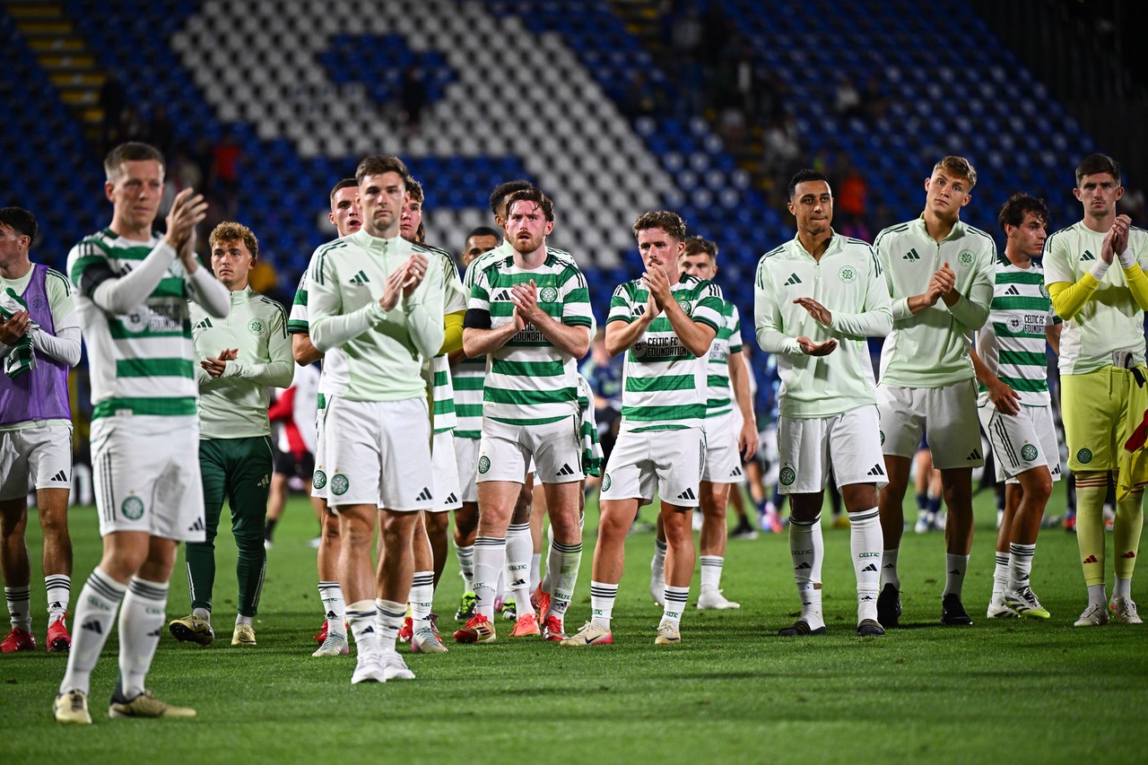 Celtic players applaud the Celtic support