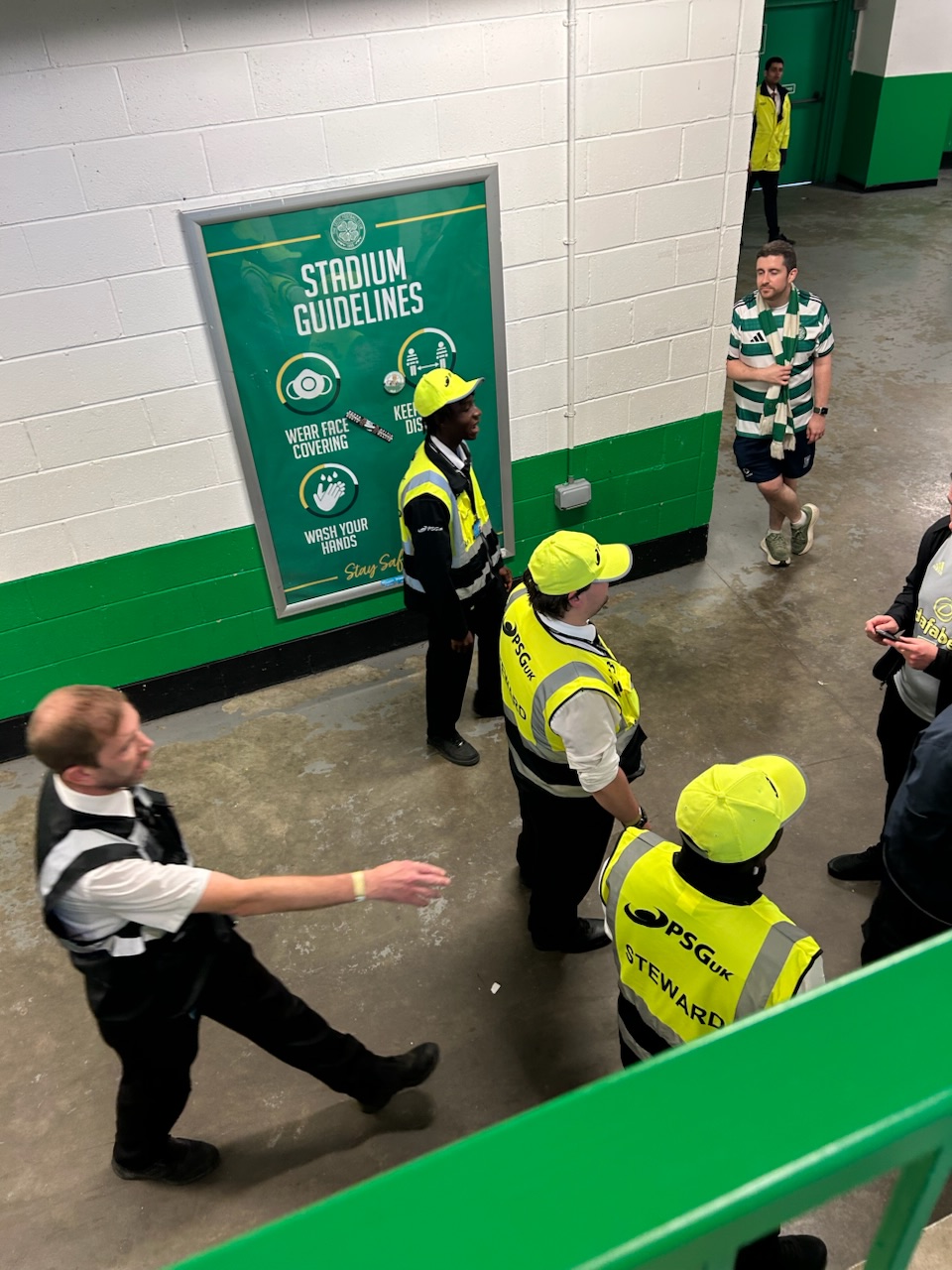 Stewards checking tickets inside Celtic Park 