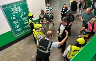 Stewards checking tickets inside Celtic Park