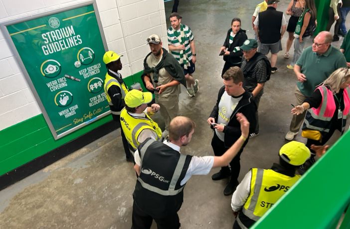 Stewards checking tickets inside Celtic Park