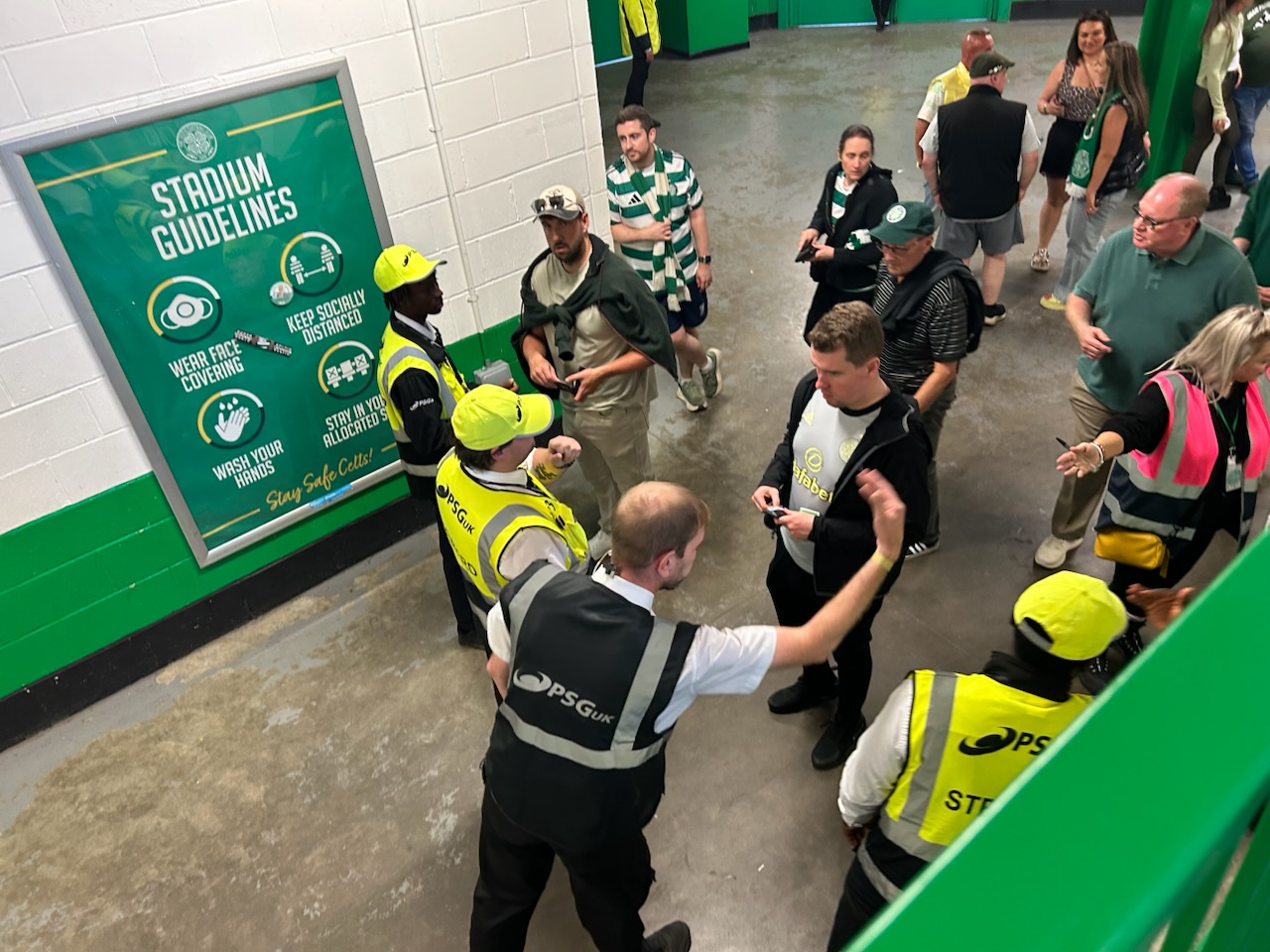 Stewards checking tickets inside Celtic Park