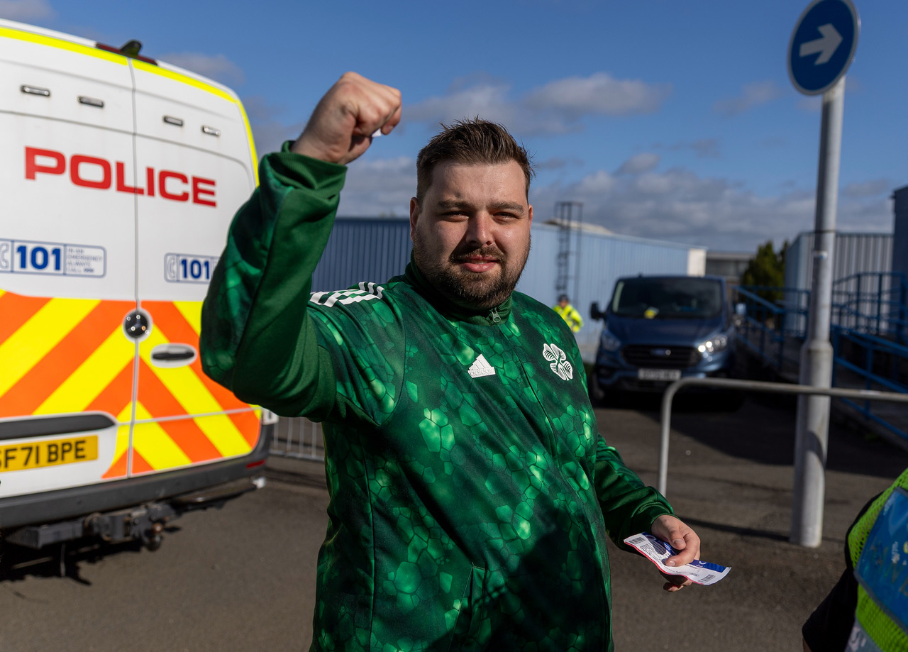 Celtic supporter arrives at Ibrox.