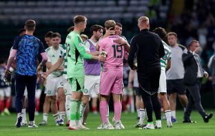 James Forrest of Celtic and Scott Bain of Falkirk embrace