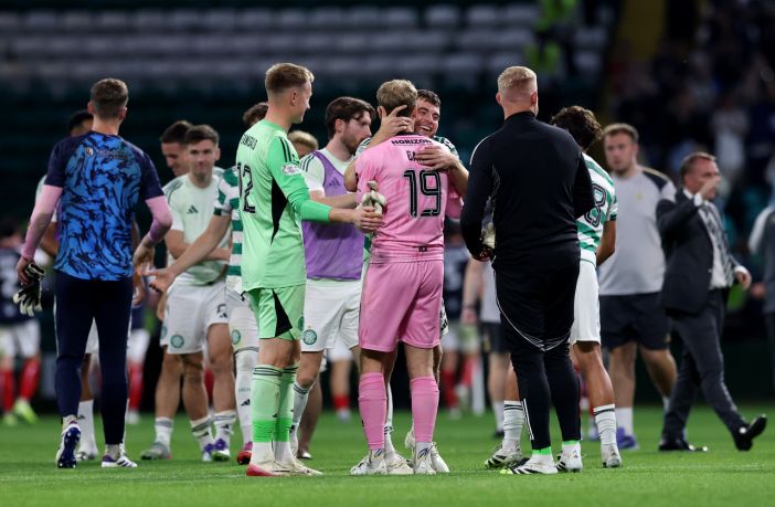 James Forrest of Celtic and Scott Bain of Falkirk embrace