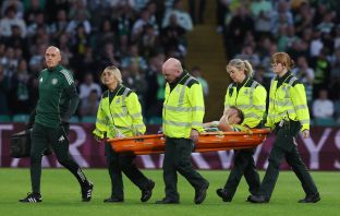 Alistair Johnston of Celtic is stretchered off