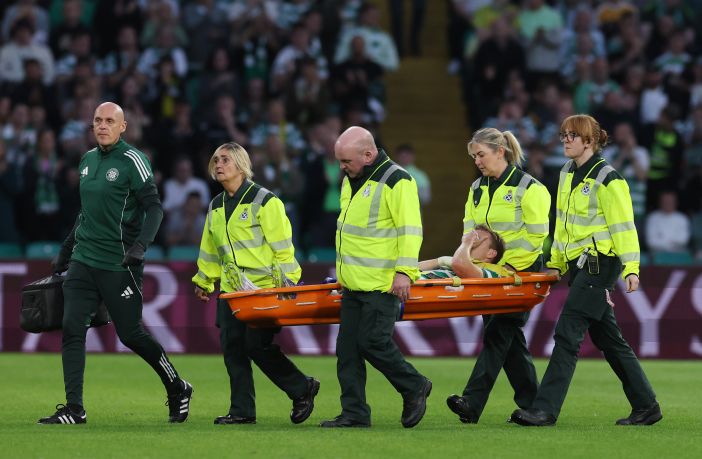 Alistair Johnston of Celtic is stretchered off