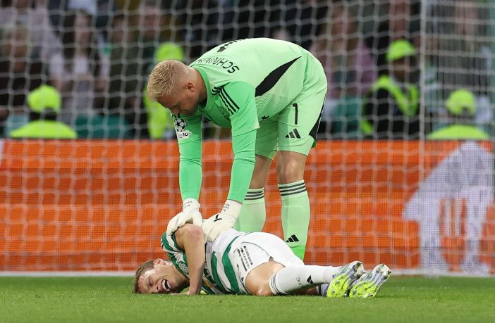 Alistair Johnston of Celtic lies injured