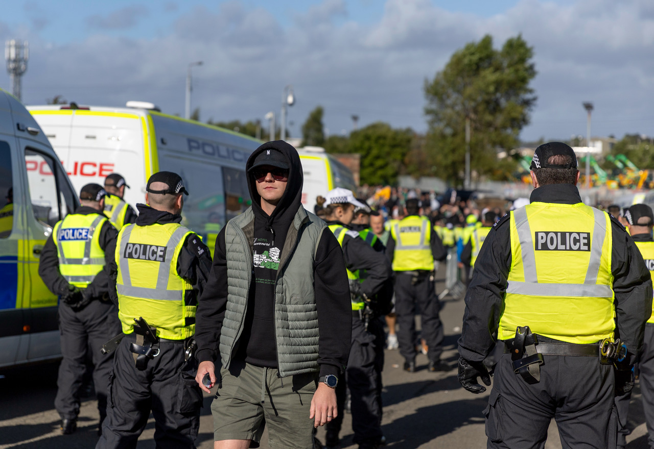 Celtic supporter arrives at Ibrox.
