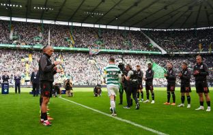 Callum McGregor delivers the trophy
