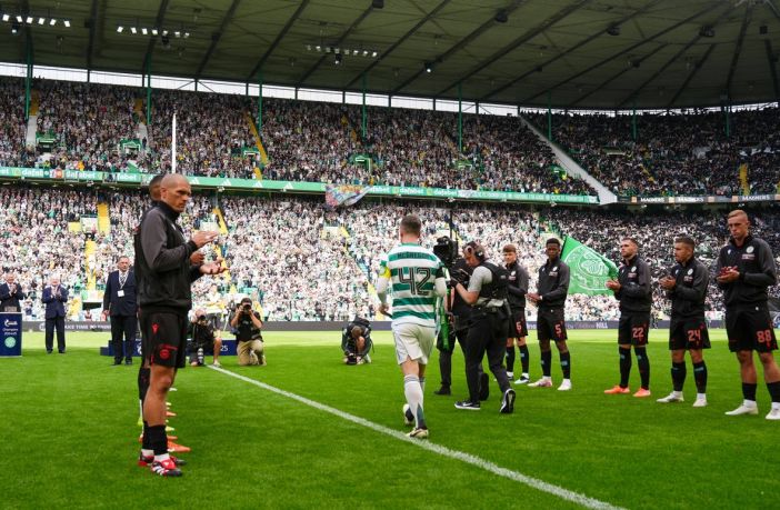 Callum McGregor delivers the trophy