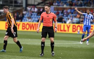 Match referee Lloyd Wilson