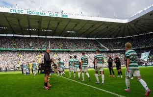 Callum McGregor delivers the trophy
