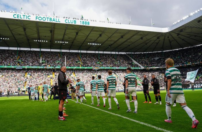 Callum McGregor delivers the trophy