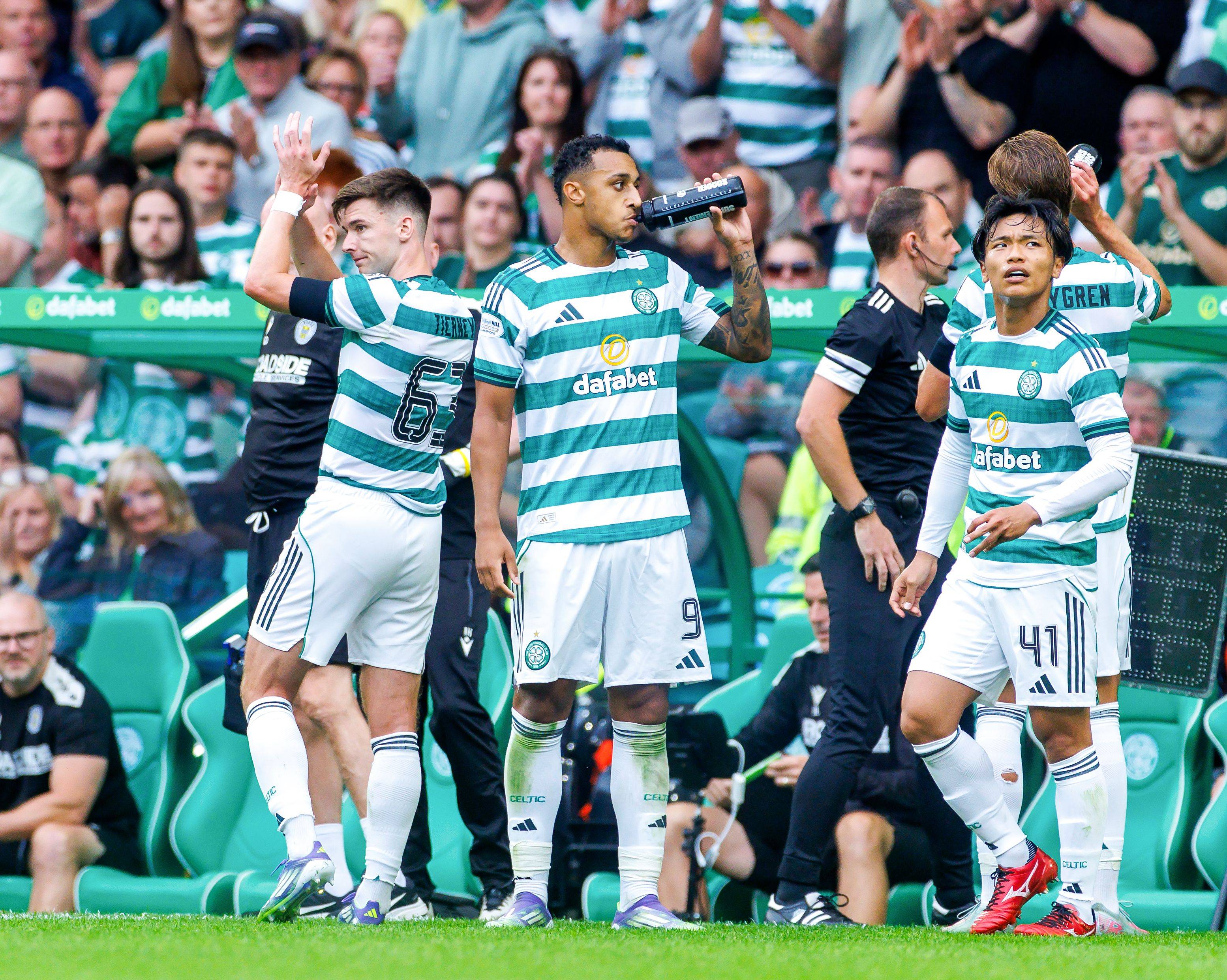 Kieran Tierney of Celtic applauds the fans