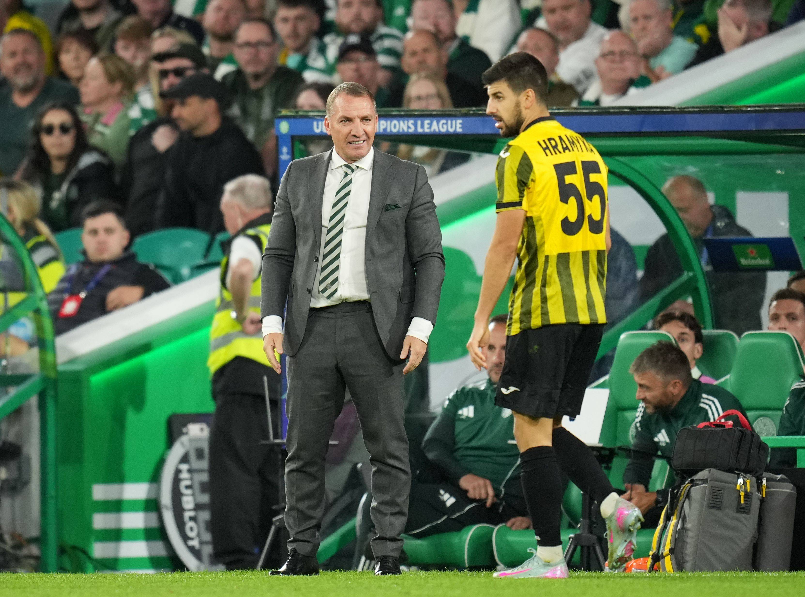 Celtic Manager Brendan Rodgers exchanges words with Valeri Gromyko of Kairat Almaty