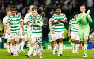 Callum McGregor and his teammates applaud the fans