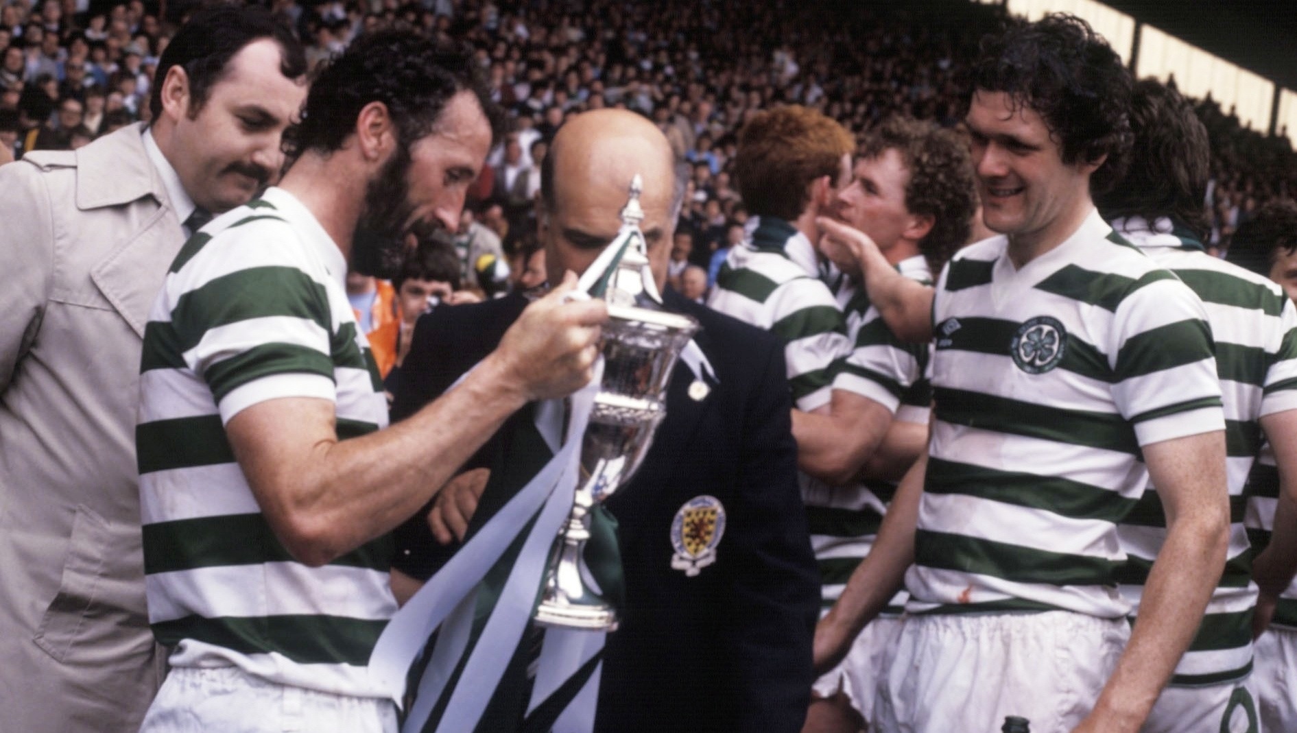 Danny McGrain collects the trophy