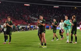 James Forrest applauds the travelling Celtic support