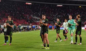 James Forrest applauds the travelling Celtic support