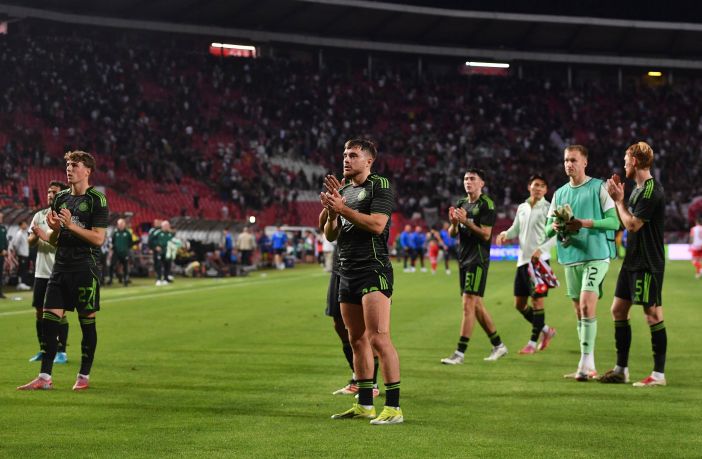 James Forrest applauds the travelling Celtic support