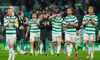 Celtic players applaud the support