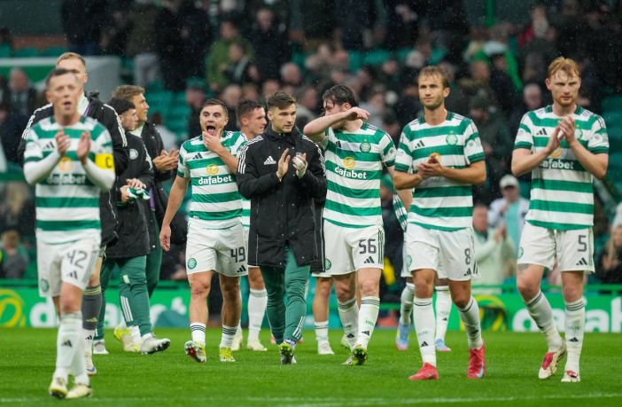 Celtic players applaud the support