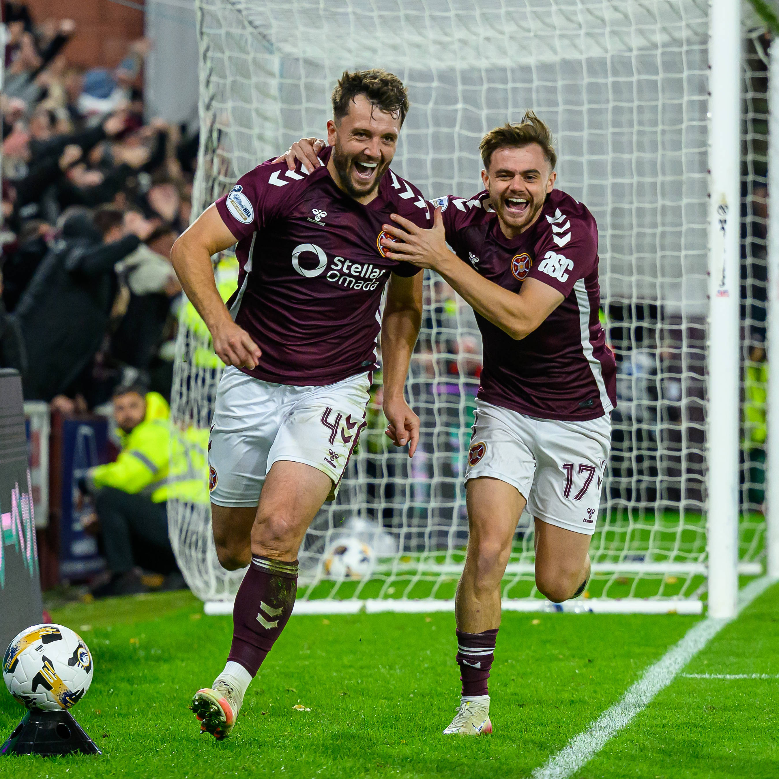 Craig Halkett of Hearts celebrates with Alan Forrest