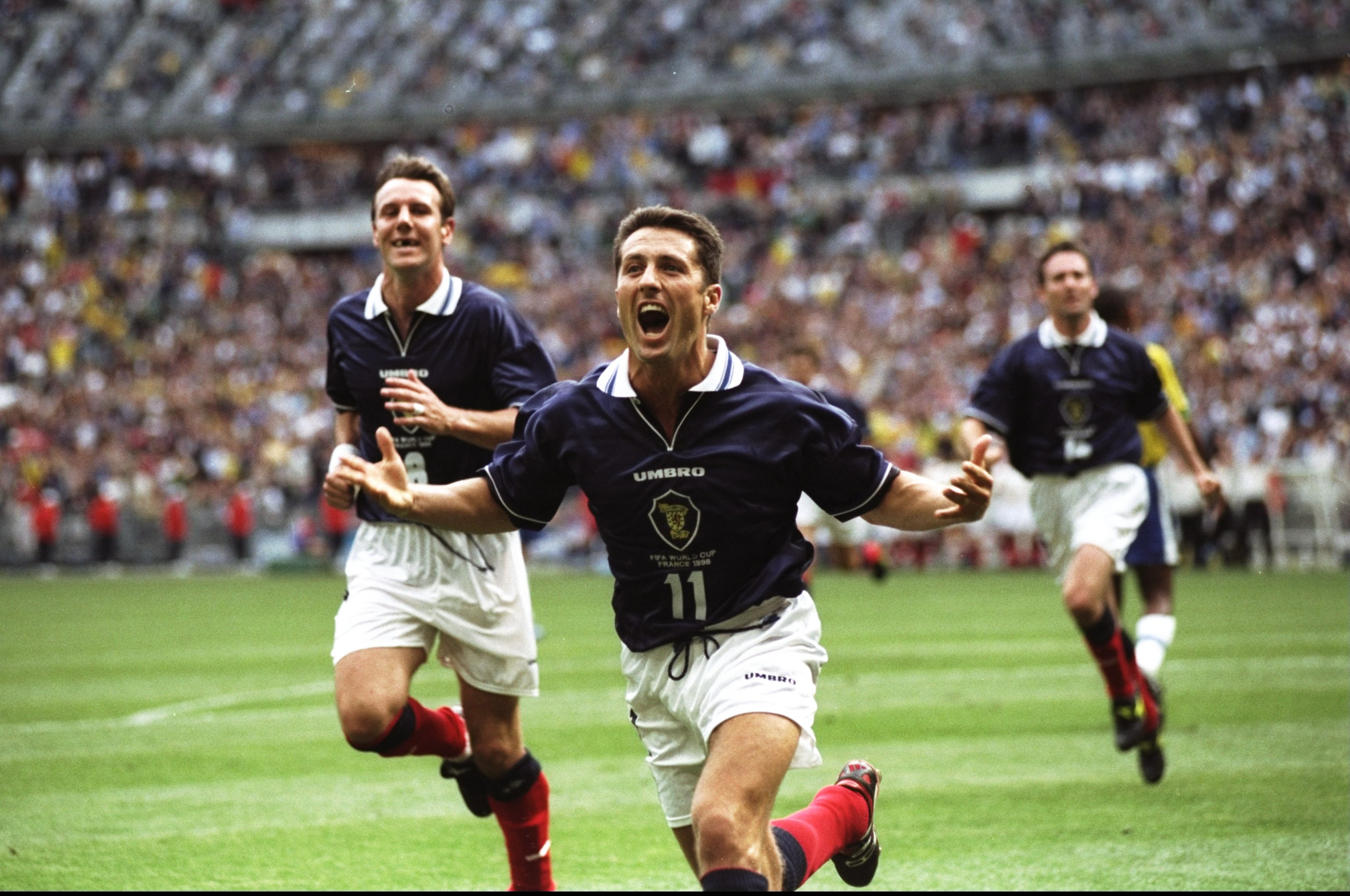 John Collins of Scotland celebrates