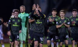 Celtic players applaud the Celtic support