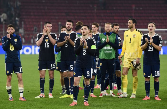 Andy Robertson of Scotland and teammates applaud the fans