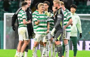 Daizen Maeda celebrates with Kasper Schmeichel