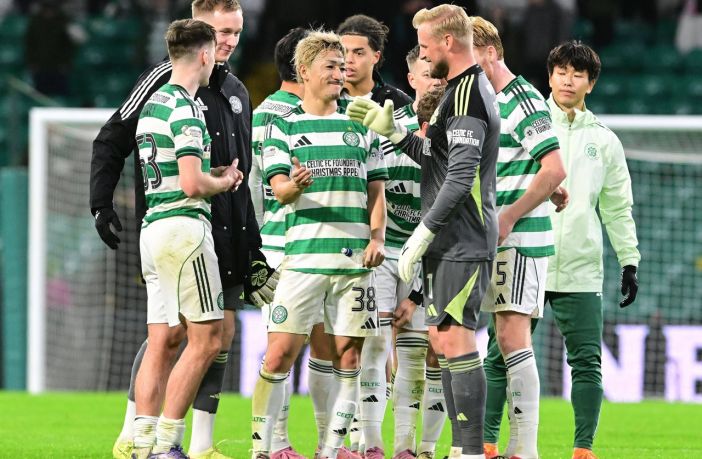 Daizen Maeda celebrates with Kasper Schmeichel
