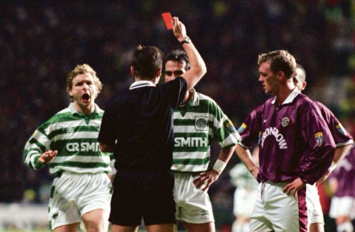30/11/96 - CELTIC V HEARTS (2-2) Paolo Di Canio is ushered from the field by manager Tommy Burns (right) after receiving a red card following an altercation with Hearts midfielder Steve Fulton. Photo The Celtic Wiki
