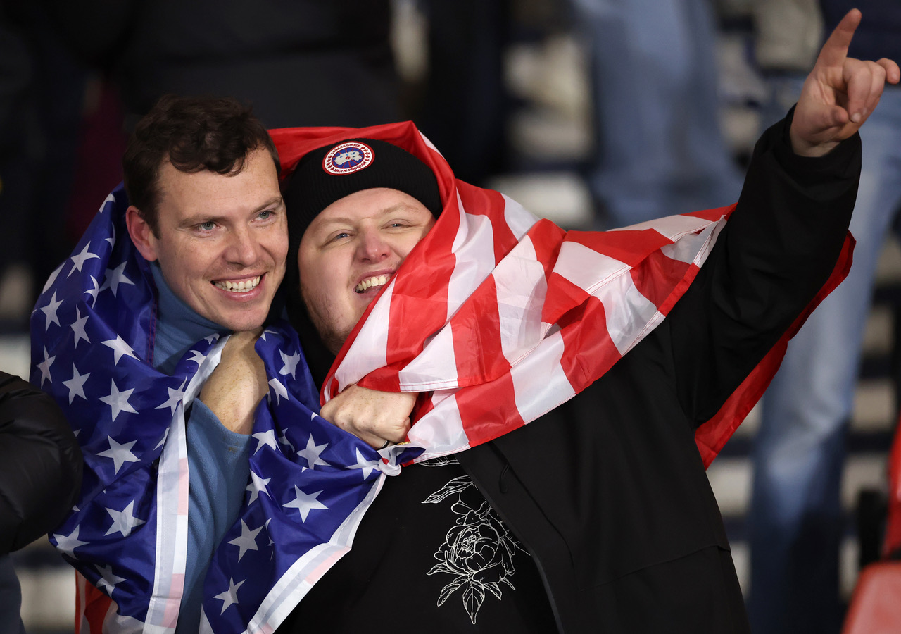 Scotland fans wrapped in a USA flag