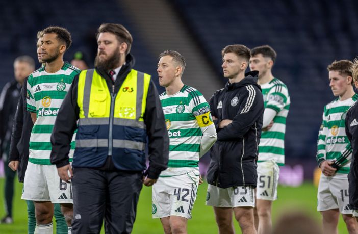 Auston Trusty and Callum McGregor look on.