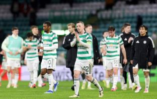 Callum McGregor of Celtic applauds the fans