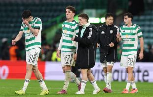 Dejected Celtic players at full-time.