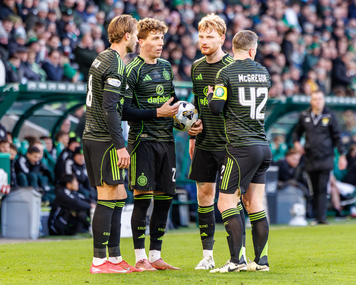 Celtic players discussing freekick options