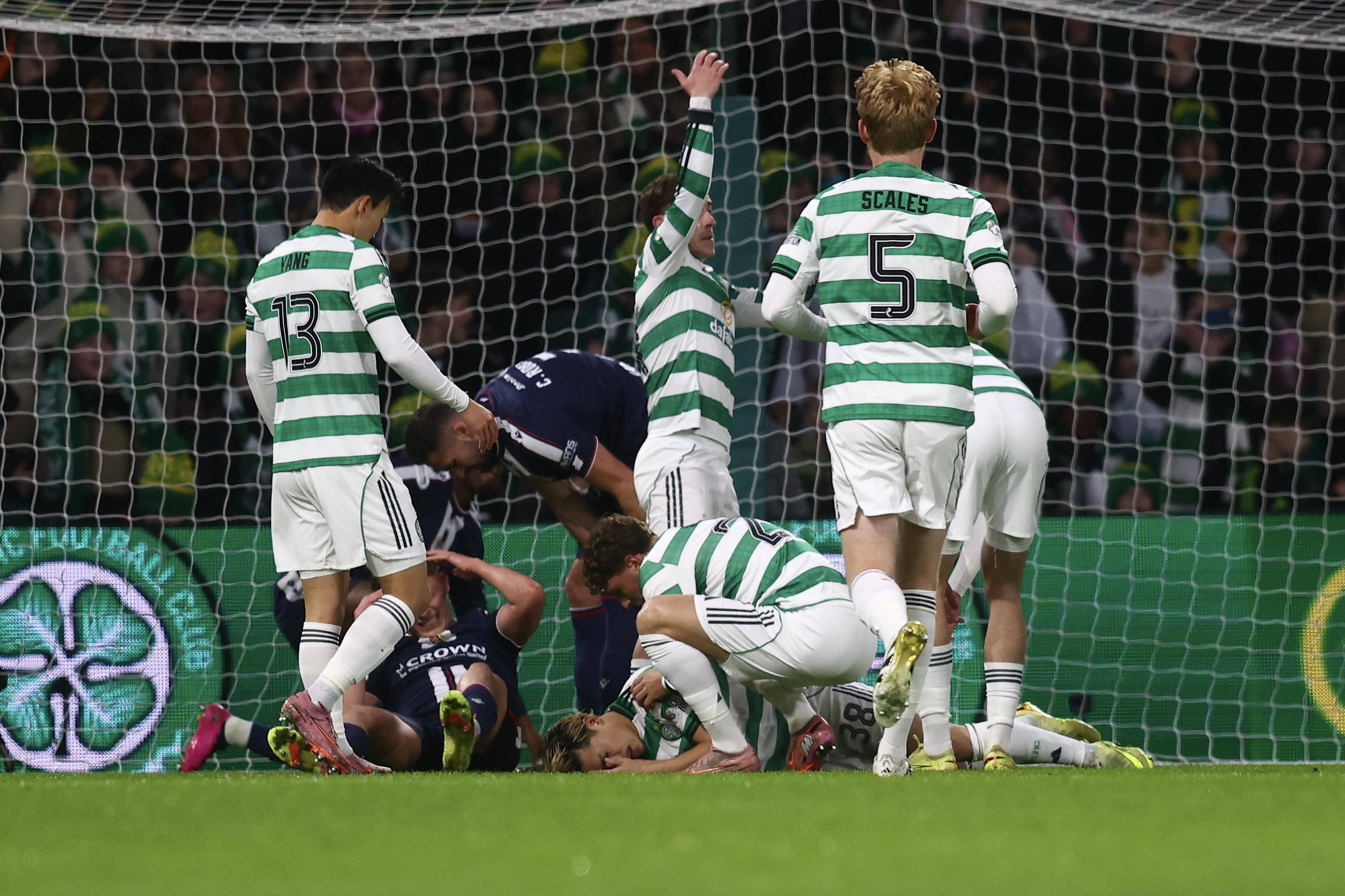  Daizen Maeda of Celtic down after a clash of heads 