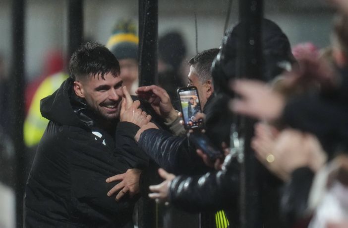 Claudio Braga of Hearts celebrates with fans