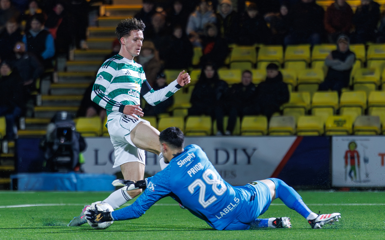 Livingston Goalkeeper Jerome Prior sliding in at the feet of Johnny Kenny
