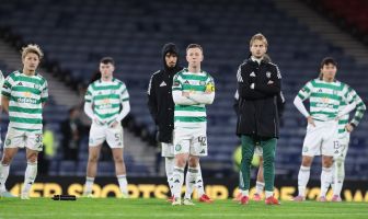 Callum McGregor and Celtic teammates look on