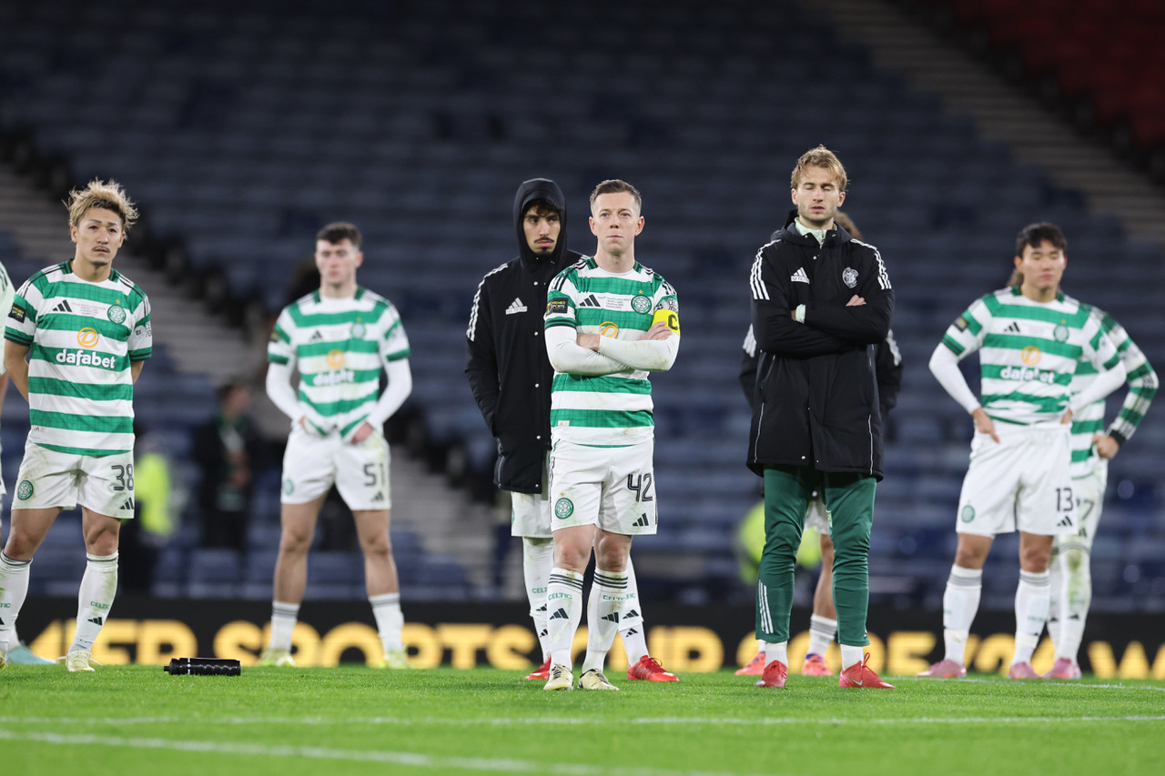Callum McGregor and Celtic teammates look on